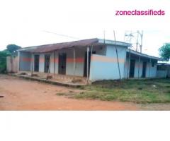 Half Plot with 8 Shops on Corner Piece at Igode Olota, Ogun State – Call 07031004001